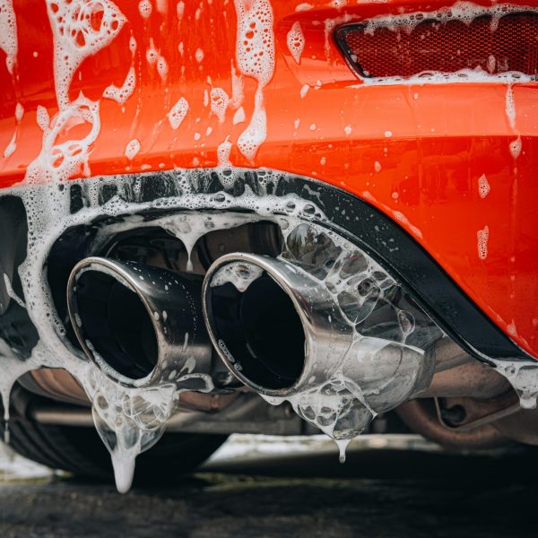 Foam running over red exhaust tips